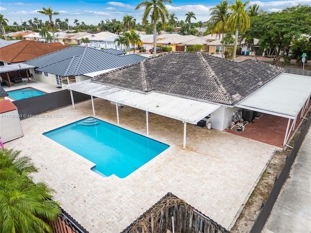 view of swimming pool with a patio area