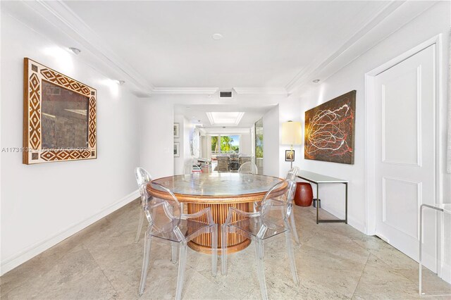 dining area featuring ornamental molding