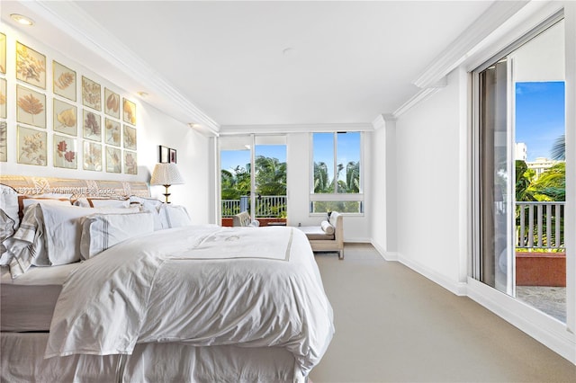 bedroom featuring carpet flooring, ornamental molding, and access to exterior