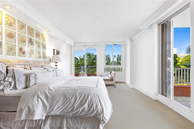 bedroom featuring crown molding and access to outside