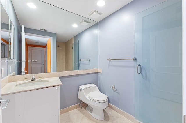 bathroom with vanity, toilet, tile patterned flooring, and a shower