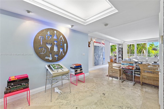 interior space with a tray ceiling, crown molding, and floor to ceiling windows