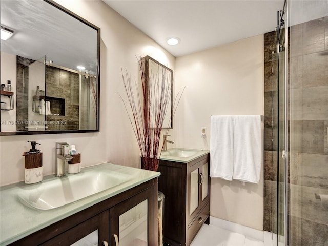 bathroom featuring walk in shower, tile patterned floors, and vanity