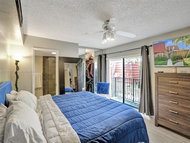 bedroom featuring ceiling fan, a textured ceiling, access to outside, a closet, and light wood-type flooring