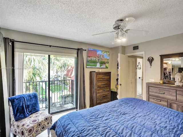 bedroom featuring a textured ceiling, access to exterior, and ceiling fan