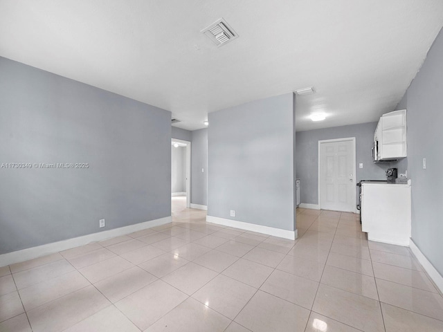 empty room featuring light tile patterned floors