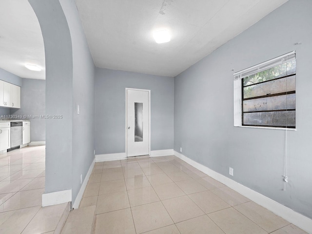 unfurnished room with light tile patterned floors