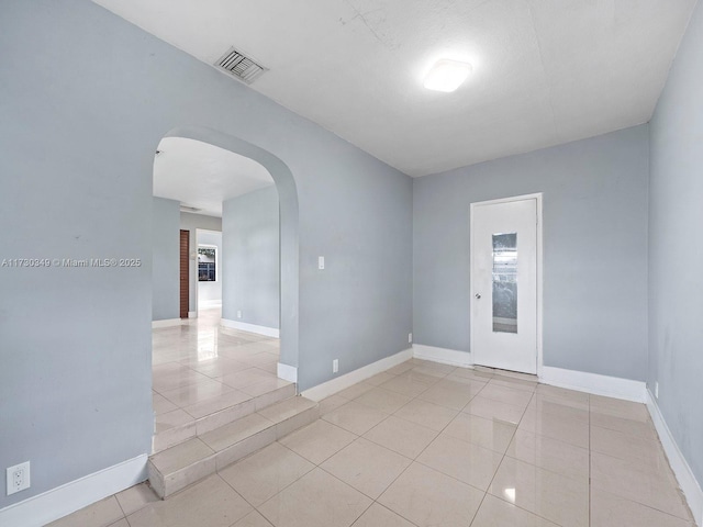 spare room with light tile patterned floors