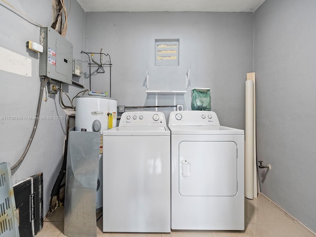 clothes washing area featuring water heater, light tile patterned floors, washing machine and clothes dryer, and electric panel