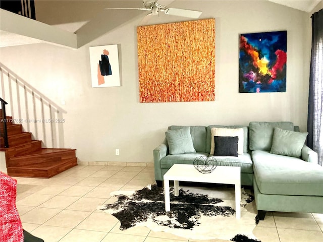 living room with vaulted ceiling, ceiling fan, and tile patterned flooring