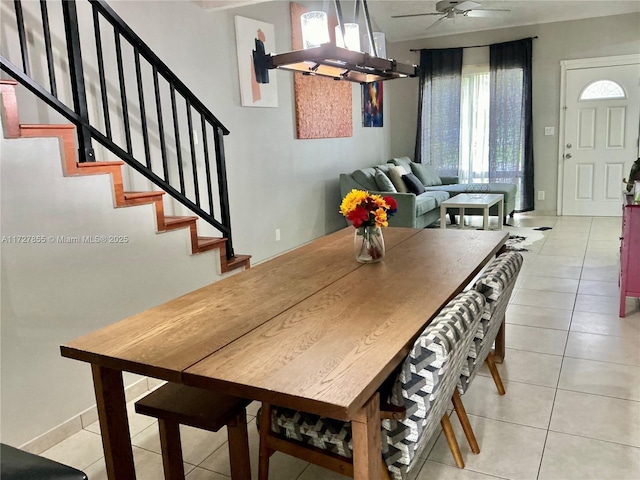 dining area featuring light tile patterned floors and ceiling fan