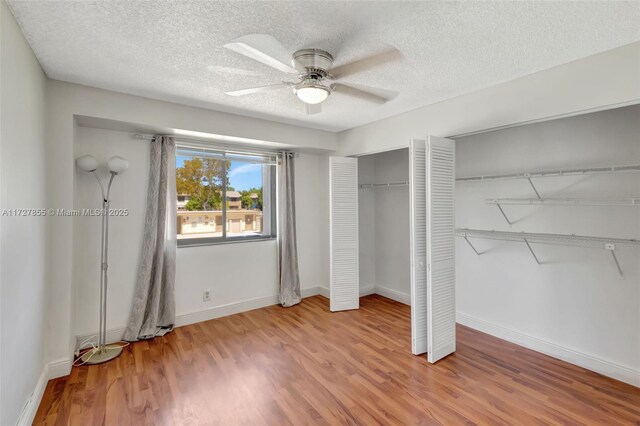 interior space featuring light tile patterned flooring and a textured ceiling