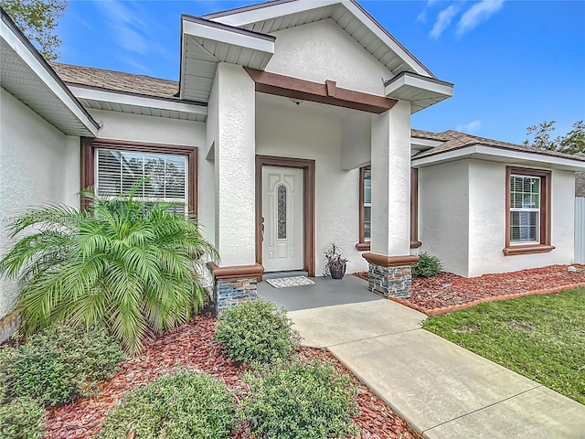 doorway to property with covered porch