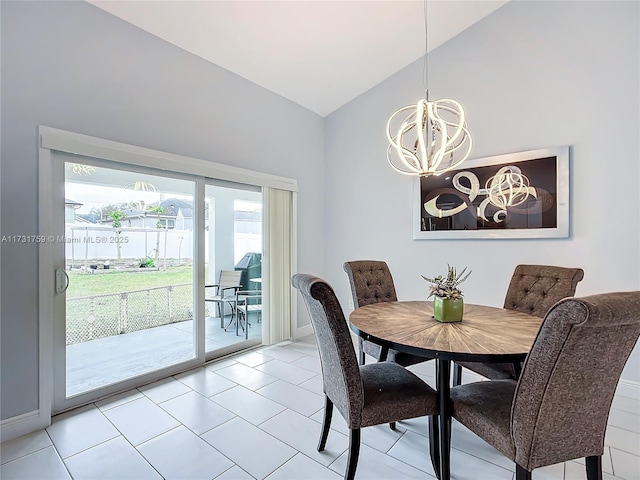 tiled dining room with lofted ceiling and an inviting chandelier