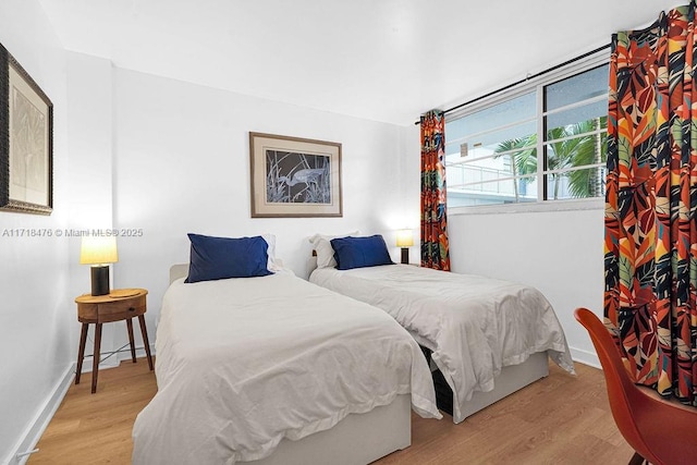 bedroom with light wood-type flooring