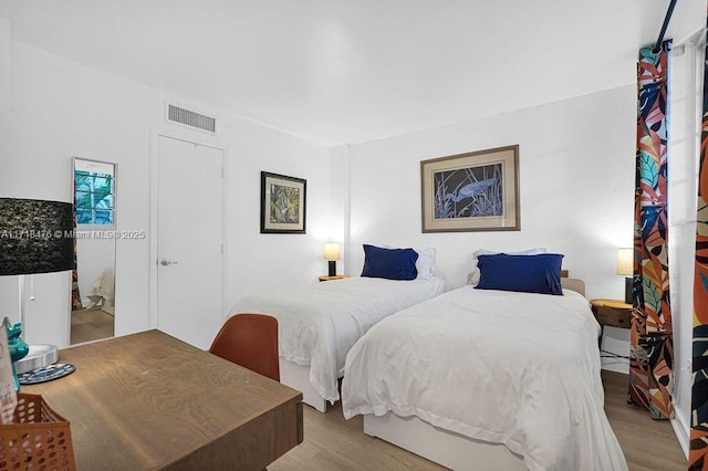 bedroom with light hardwood / wood-style floors