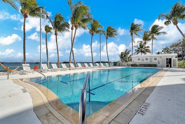 view of pool featuring a water view