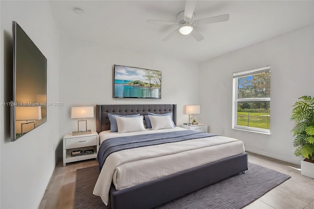 bedroom with ceiling fan and light wood-type flooring