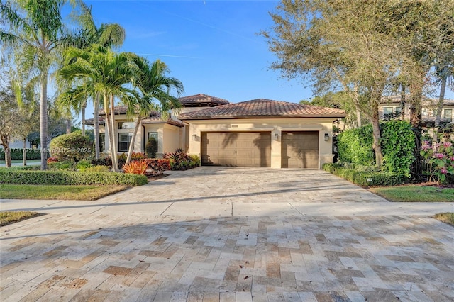 mediterranean / spanish home featuring a garage