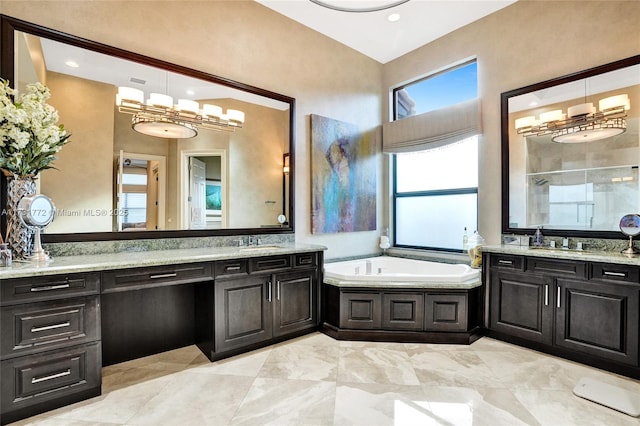 bathroom featuring vanity and shower with separate bathtub