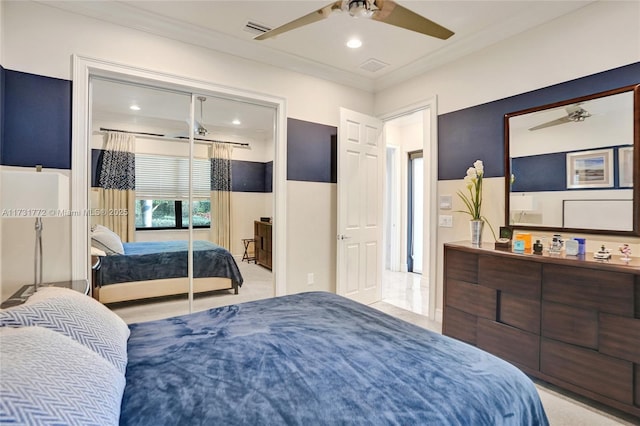 bedroom featuring crown molding, a closet, and ceiling fan