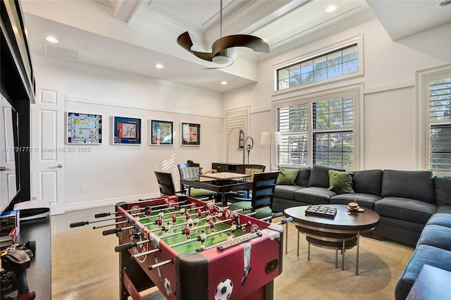 playroom featuring beamed ceiling and ceiling fan