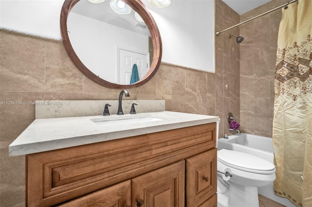 full bathroom featuring vanity, toilet, tile walls, and shower / bath combo