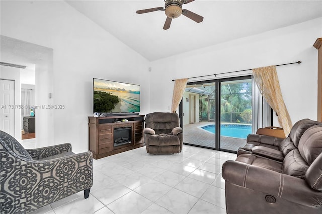 living room featuring ceiling fan and high vaulted ceiling