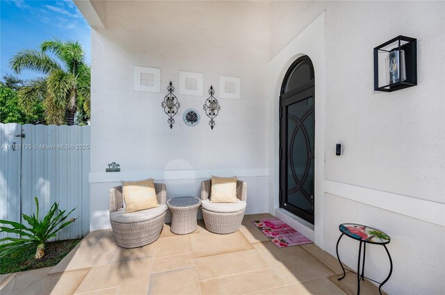16185 SW 2nd Dr, Pembroke Pines, FL 33027 - view of exterior entry featuring a patio area and stucco siding