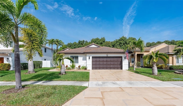 ranch-style house with a front lawn, stucco siding, an attached garage, driveway, and a tile roof