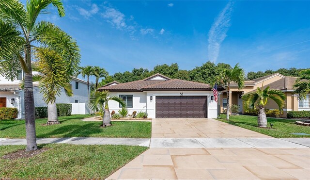 16185 SW 2nd Dr, Pembroke Pines, FL 33027 - ranch-style house with a front lawn, stucco siding, an attached garage, driveway, and a tile roof