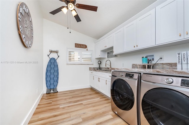 clothes washing area featuring sink, cabinets, ceiling fan, independent washer and dryer, and light hardwood / wood-style floors