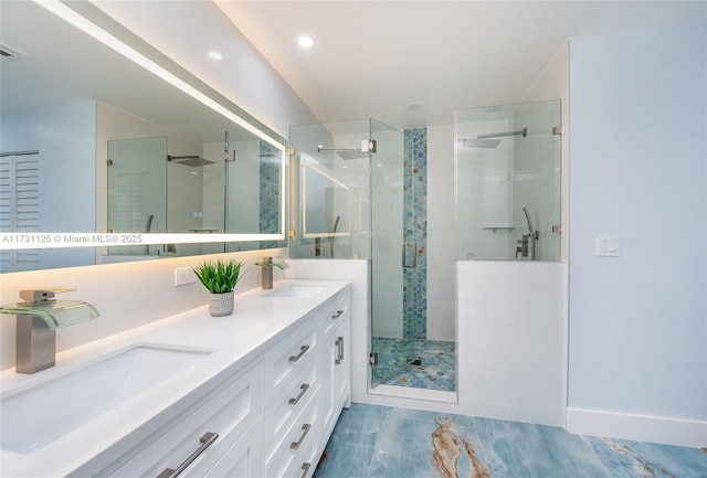 bathroom featuring vanity and a shower with shower door