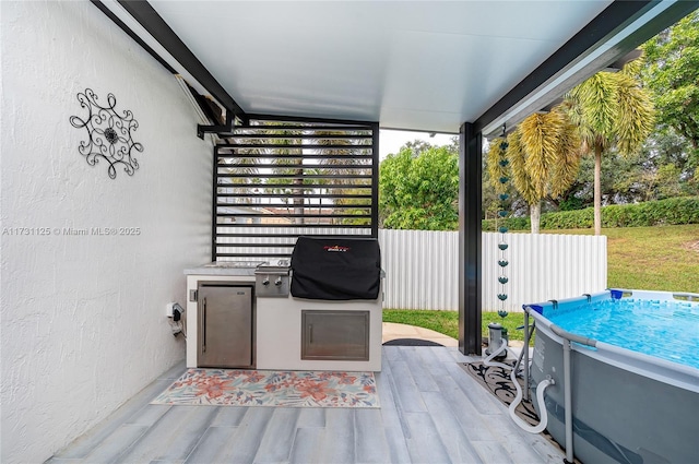 view of patio featuring exterior kitchen