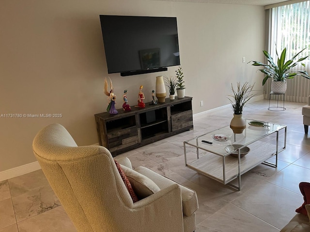 living room featuring floor to ceiling windows