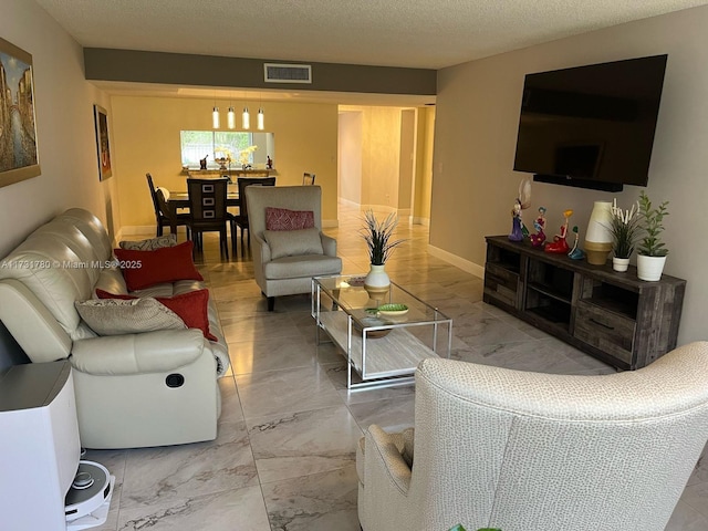 living room featuring a textured ceiling