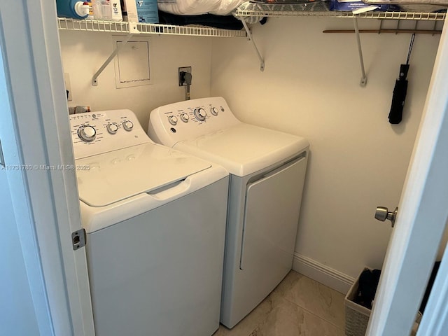 washroom featuring washing machine and dryer