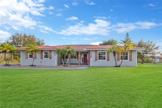 ranch-style house featuring a front yard