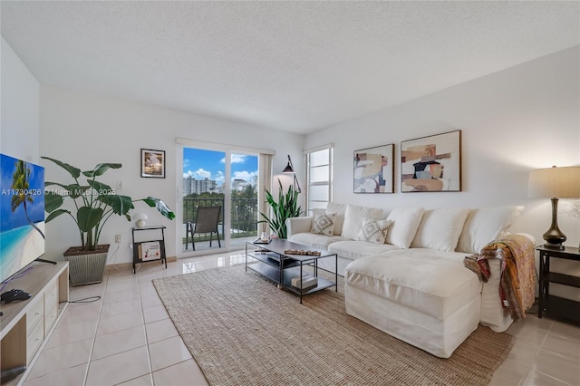 tiled living room with a textured ceiling