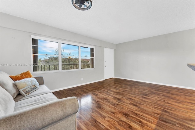 living room with dark hardwood / wood-style floors