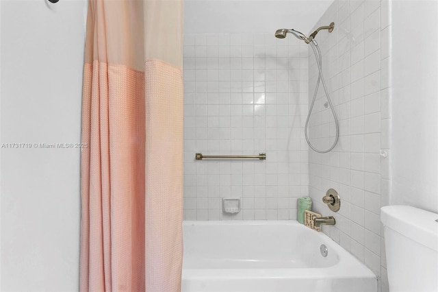 bathroom featuring shower / tub combo with curtain and toilet