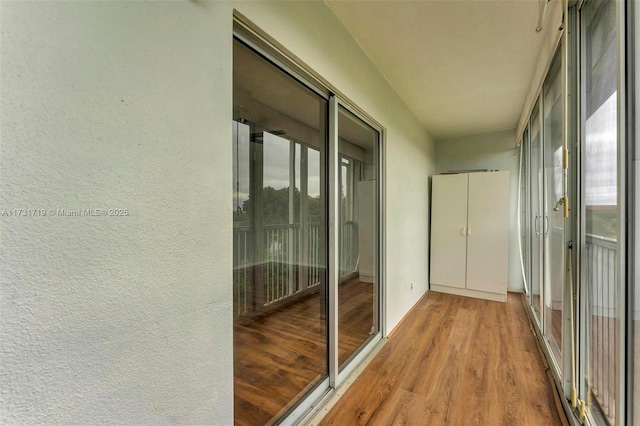 corridor featuring hardwood / wood-style flooring