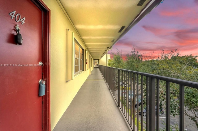 view of balcony at dusk