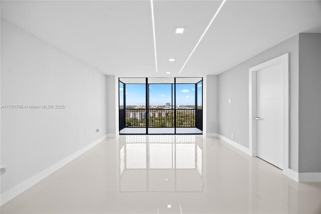 spare room featuring expansive windows