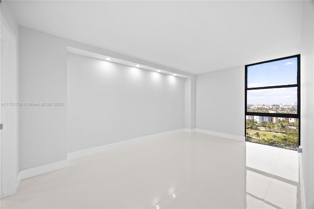 spare room featuring floor to ceiling windows