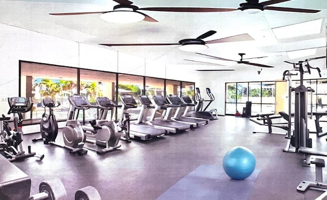 gym featuring ceiling fan and a textured ceiling