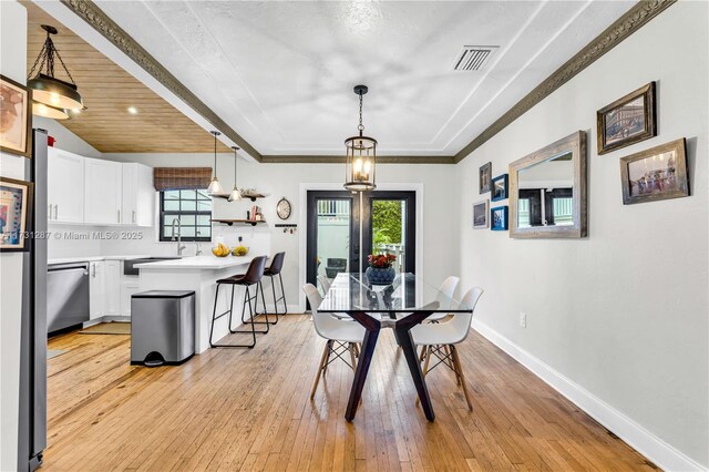 dining space featuring wooden ceiling and light wood-type flooring