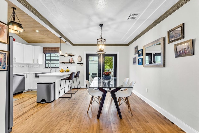 dining space featuring light wood-type flooring