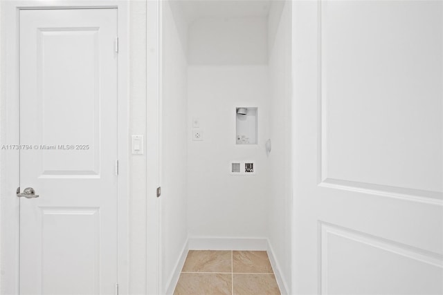 washroom featuring electric dryer hookup, light tile patterned floors, and hookup for a washing machine