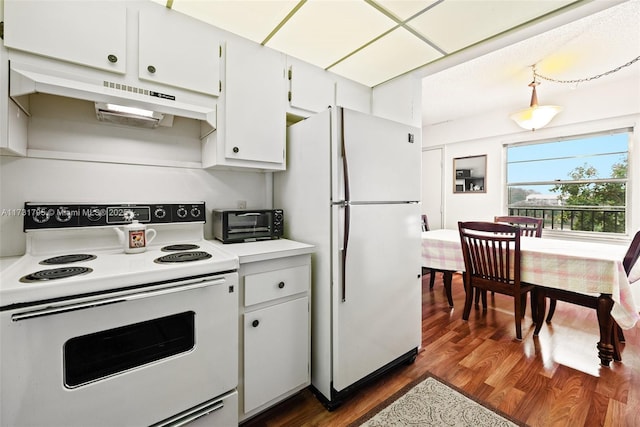 kitchen featuring white cabinetry, white appliances, dark hardwood / wood-style floors, and hanging light fixtures